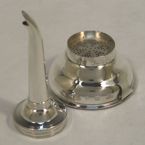 A handsome Sterling Silver wine decanting funnel, having a plain round body with applied bead borders, a plain side clip, and removable funnel. this elegant silver wine decanting funnel was made by A. Chick and Sons Ltd., of London in 1979. The dimensions of this fine hand-made silver wine decanting funnel are height 13.5 cms (5.3 inches), diameter of bowl 8 cms (3 inches), and it weighs approx. 66g (2 troy ounces).