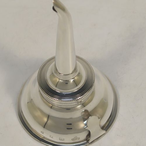 A handsome Sterling Silver wine decanting funnel, having a plain round body with applied bead borders, a plain side clip, and removable funnel. this elegant silver wine decanting funnel was made by A. Chick and Sons Ltd., of London in 1979. The dimensions of this fine hand-made silver wine decanting funnel are height 13.5 cms (5.3 inches), diameter of bowl 8 cms (3 inches), and it weighs approx. 66g (2 troy ounces).