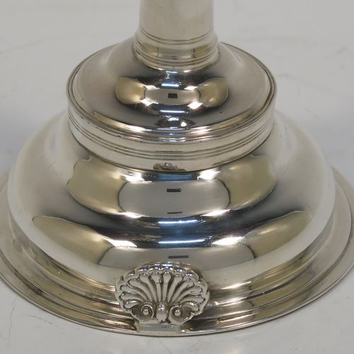 A very handsome Antique Georgian Sterling Silver wine decanting funnel, having a plain round body with an applied double feather-edged border and a cast shell style side clip, and original removable funnel. This elegant antique silver wine funnel was made in London in 1819. The dimensions of this fine hand-made antique silver wine decanting funnel are height 13 cms (5 inches), diameter of bowl 9.5 cms (3.75 inches), and it weighs approx. 102g (3.3 troy ounces).