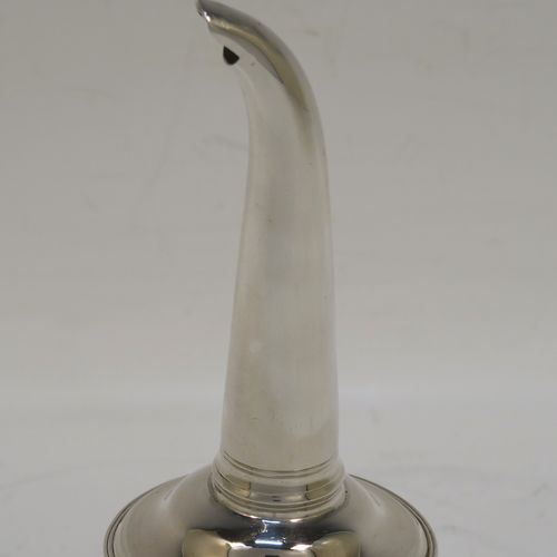 A very handsome Antique Georgian Sterling Silver wine decanting funnel, having a plain round body with an applied double feather-edged border and a cast shell style side clip, and original removable funnel. This elegant antique silver wine funnel was made in London in 1819. The dimensions of this fine hand-made antique silver wine decanting funnel are height 13 cms (5 inches), diameter of bowl 9.5 cms (3.75 inches), and it weighs approx. 102g (3.3 troy ounces).