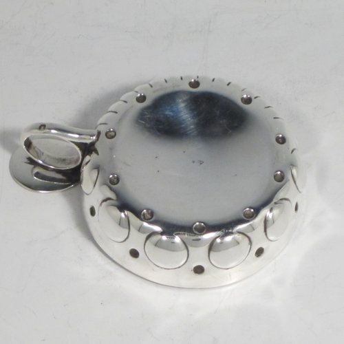 Antique Victorian Silver wine taster, having a round body, with hand-chased swirl-fluted decoration and punched bead-work, a loop handle with thumb-piece, and sitting on a concave base. Made in Paris, France ca. 1890, with a Minerva 2nd Quality mark, indicating 800 standard silver. The dimensions of this fine hand-made silver wine taster testavine are diameter 8 cms (3 inches), and height 2.5 cms (1 inch), and it weighs approx. 105g (3.4 troy ounces).
