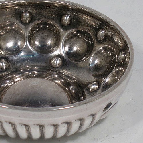 A very pretty Antique Victorian Silver wine taster, having a round body, with hand-chased fluted and ball decoration, a loop handle with thumb-piece, and sitting on a flat base. Made in Paris, France ca. 1890, with a Minerva 1st Quality mark, indicating 950 standard silver. The dimensions of this fine hand-made antique silver wine taster testavine are diameter 8 cms (3 inches), height 2.5 cms (1 inch), and it weighs approx. 69g (2.2 troy ounces).  