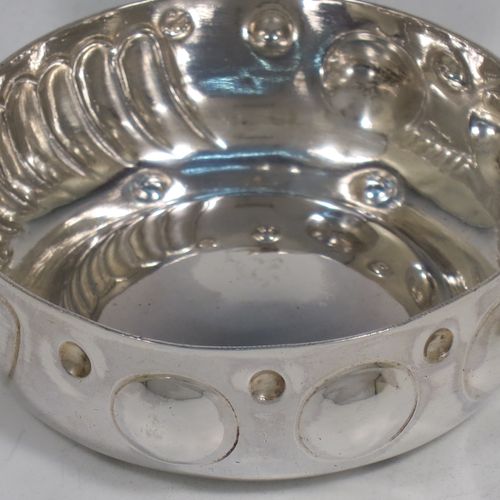 A pretty Antique Victorian Silver French testavine or wine taster, having a round body, with hand-chased bead and swirl-fluted decoration, a loop handle with thumb-piece, and sitting on a concave base. Made in Paris, France ca. 1890, with a Minerva 1st Quality mark, indicating 950 standard silver. The dimensions of this fine hand-made antique silver wine taster or testavine are diameter 7 cms (2.75 inches), and height 3 cms (1.3 inch), and it weighs approx. 72g (2.3 troy ounces).   